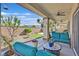 Inviting covered patio with comfortable seating, overhead fans, and views of the manicured backyard at 5226 Lignum Ave # 1, Pahrump, NV 89061