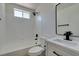 Clean bathroom with a white vanity, modern fixtures, and a shower over tub at 5273 Manassas Ave, Las Vegas, NV 89122