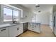 Eat-in kitchen featuring white cabinets, quartz countertops, and stainless steel appliances at 5273 Manassas Ave, Las Vegas, NV 89122