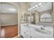 Bathroom vanity with double sinks, a large mirror, and good natural lighting at 544 Rancho Del Sol Way, North Las Vegas, NV 89031