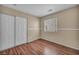 Bright bedroom with wood floors, a window, and closet, providing a cozy and functional space at 544 Rancho Del Sol Way, North Las Vegas, NV 89031