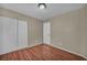 Bedroom with hardwood floors, closet with sliding doors, neutral walls and natural light at 544 Rancho Del Sol Way, North Las Vegas, NV 89031