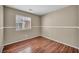 Bedroom featuring hardwood floors, neutral walls, and a bright window at 544 Rancho Del Sol Way, North Las Vegas, NV 89031