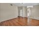 Bedroom with hardwood floors, neutral walls, and view into bathroom at 544 Rancho Del Sol Way, North Las Vegas, NV 89031