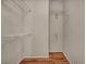 Walk-in closet with built in shelving and hardwood floors at 544 Rancho Del Sol Way, North Las Vegas, NV 89031