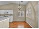 Bright dining area featuring hardwood floors, a modern light fixture and large window at 544 Rancho Del Sol Way, North Las Vegas, NV 89031