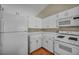 Kitchen featuring modern appliances, white cabinets, and ample counter space, ideal for cooking and entertaining at 544 Rancho Del Sol Way, North Las Vegas, NV 89031