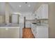 Clean kitchen with white appliances and cabinets, offering a functional and well-organized cooking space at 544 Rancho Del Sol Way, North Las Vegas, NV 89031