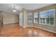 Bright living room featuring laminate floors and large windows, offering a versatile space for relaxation and entertaining at 544 Rancho Del Sol Way, North Las Vegas, NV 89031