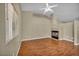 Bright living room with large windows, hardwood floors, and a charming fireplace, creating a cozy and inviting atmosphere at 544 Rancho Del Sol Way, North Las Vegas, NV 89031