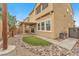 Charming backyard featuring rocks, grass, dog run and covered patio with a well-maintained landscape at 5731 Sedona Springs St, North Las Vegas, NV 89031