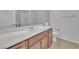 Bathroom featuring a single sink vanity, a large mirror, and a shower at 5731 Sedona Springs St, North Las Vegas, NV 89031