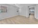 Neutral bedroom with wood-look floors, large windows, and ample space at 5731 Sedona Springs St, North Las Vegas, NV 89031