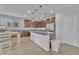 Modern kitchen with stainless steel appliances, an island, and a dining area at 5731 Sedona Springs St, North Las Vegas, NV 89031