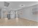 Bright loft area featuring wood flooring, neutral walls, modern railings, and lots of natural light from multiple windows at 5731 Sedona Springs St, North Las Vegas, NV 89031