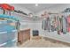 Organized walk-in closet with ample shelving, hanging space, a dresser, and stylish wood flooring, offering great storage at 5731 Sedona Springs St, North Las Vegas, NV 89031