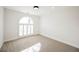 Unfurnished bedroom featuring neutral carpet, white walls, and lots of natural light at 5840 N El Capitan Way, Las Vegas, NV 89149