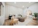 Bright living room with a neutral color palette, comfortable seating, and an arched doorway to other spaces at 5840 N El Capitan Way, Las Vegas, NV 89149