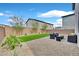 This backyard has gravel, artificial turf, brick wall, and outdoor furniture at 6130 Yuzu Pl, Las Vegas, NV 89122