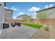 Beautiful backyard featuring a patio with seating area and artificial grass at 6130 Yuzu Pl, Las Vegas, NV 89122