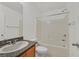 Bathroom featuring a tub with shower and a vanity with granite countertops at 6130 Yuzu Pl, Las Vegas, NV 89122