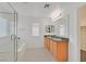 Bathroom with a soaking tub, glass shower, double sinks, and granite countertops at 6130 Yuzu Pl, Las Vegas, NV 89122