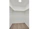 Walk-in closet featuring ample shelving and neutral carpeting at 6130 Yuzu Pl, Las Vegas, NV 89122
