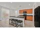 Eat-in kitchen with wood cabinets, granite countertops, stainless appliances, and sliding glass doors to the yard at 6130 Yuzu Pl, Las Vegas, NV 89122