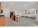 Eat-in kitchen features granite countertops, wood cabinets, an island with barstool seating, and stainless appliances at 6130 Yuzu Pl, Las Vegas, NV 89122