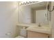 Functional bathroom featuring a toilet and a vanity with a sink and mirror at 653 Mountain Rdg, Mesquite, NV 89027