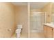 A well-maintained bathroom featuring a toilet, shower, and vanity at 653 Mountain Rdg, Mesquite, NV 89027