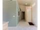 Bright hallway featuring neutral paint, tile floors, and multiple doorways leading to other rooms at 653 Mountain Rdg, Mesquite, NV 89027