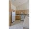 Well-lit kitchen with white appliances and plentiful cabinet space offers a practical cooking area at 653 Mountain Rdg, Mesquite, NV 89027