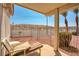 Relaxing covered patio with cozy seating and views of the desert landscape at 653 Mountain Rdg, Mesquite, NV 89027