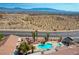 Beautiful desert neighborhood featuring a pool with nearby mountains and city skyline at 653 Mountain Rdg, Mesquite, NV 89027