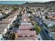 Expansive aerial perspective showing well-planned community, meticulously lined streets, and green trees at 6546 American Flower St, Las Vegas, NV 89148