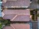 Detailed aerial shot of backyard and rooftops, showcasing pristine lawn, patio furniture, and neat landscaping at 6546 American Flower St, Las Vegas, NV 89148