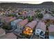 Charming aerial view of backyard with covered patio, well-maintained lawn, and stylish patio furniture for outdoor living at 6546 American Flower St, Las Vegas, NV 89148