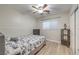 Bright bedroom featuring wood-look floors and a closet at 6546 American Flower St, Las Vegas, NV 89148