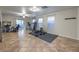 Spacious bonus room with tile flooring and sliding door to the patio at 6546 American Flower St, Las Vegas, NV 89148