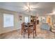 Charming dining area with natural light, views to the living room, and neutral color palette at 6546 American Flower St, Las Vegas, NV 89148