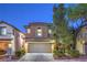 Inviting two-story home with a two-car garage, stucco finish, neat landscaping, and a warm, welcoming ambiance at 6546 American Flower St, Las Vegas, NV 89148