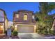 Charming two-story home featuring a two-car garage, classic stucco exterior, and well-maintained landscaping at 6546 American Flower St, Las Vegas, NV 89148