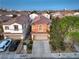Eye-level shot of a two-story home featuring a well-manicured yard, and two-car garage at 6546 American Flower St, Las Vegas, NV 89148