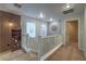 Upstairs hallway featuring modern design elements, creating a stylish transition space at 6546 American Flower St, Las Vegas, NV 89148