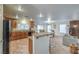 Open floor plan includes a modern kitchen with stainless appliances and seamless flow to other living spaces at 6546 American Flower St, Las Vegas, NV 89148