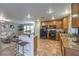 Well-equipped kitchen featuring granite countertops, stainless steel appliances, and a breakfast bar at 6546 American Flower St, Las Vegas, NV 89148