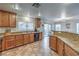 Functional kitchen with ample counter space, plenty of cabinets, and convenient access to the dining area at 6546 American Flower St, Las Vegas, NV 89148