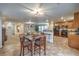 Open-concept living space features a kitchen, dining area, and comfortable living room at 6546 American Flower St, Las Vegas, NV 89148