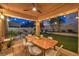 Covered patio with outdoor dining set, ideal for enjoying meals al fresco at 6546 American Flower St, Las Vegas, NV 89148